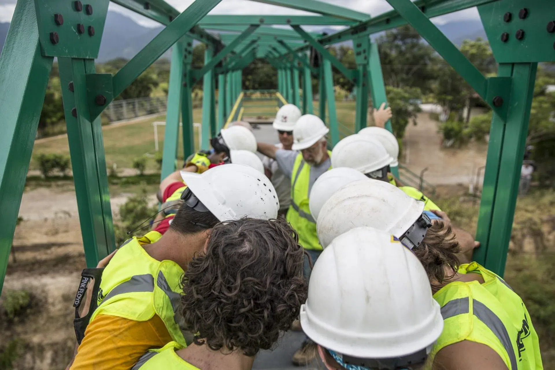 Workers assemble on bridge